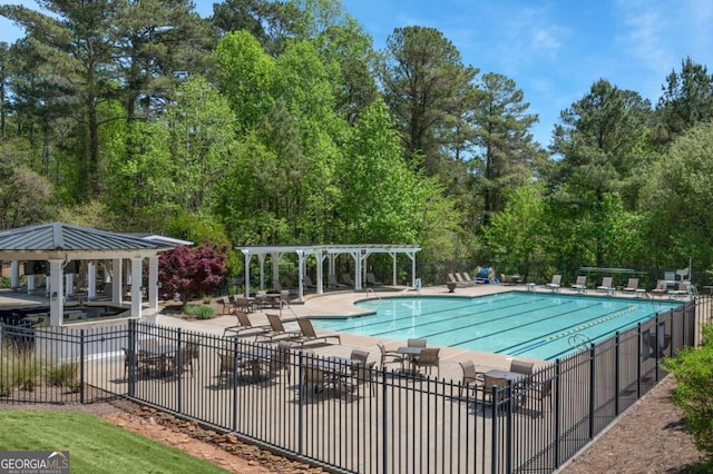 community pool featuring a patio, fence, a pergola, and a gazebo