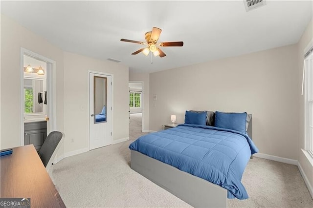 bedroom with carpet floors, visible vents, baseboards, and a ceiling fan