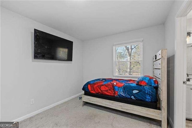 carpeted bedroom with baseboards