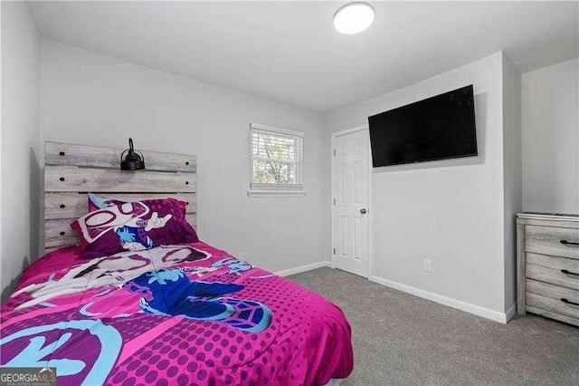 carpeted bedroom with baseboards