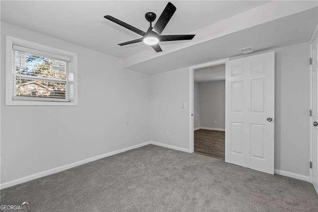 unfurnished bedroom featuring carpet, ceiling fan, and baseboards