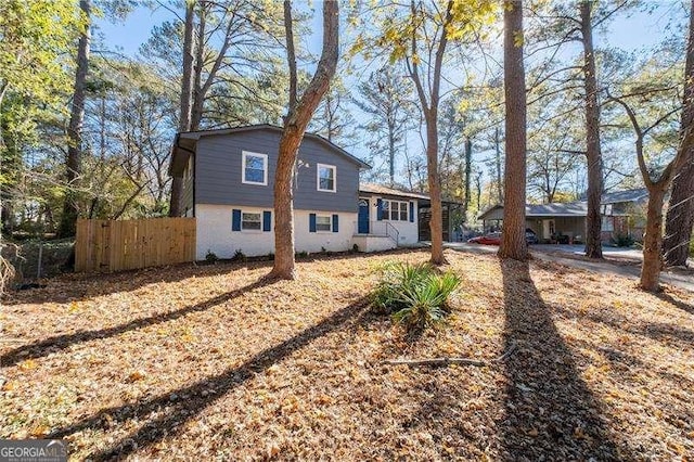 view of front of house featuring fence