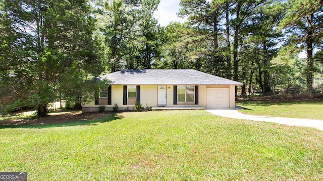 ranch-style home featuring a front yard and brick siding