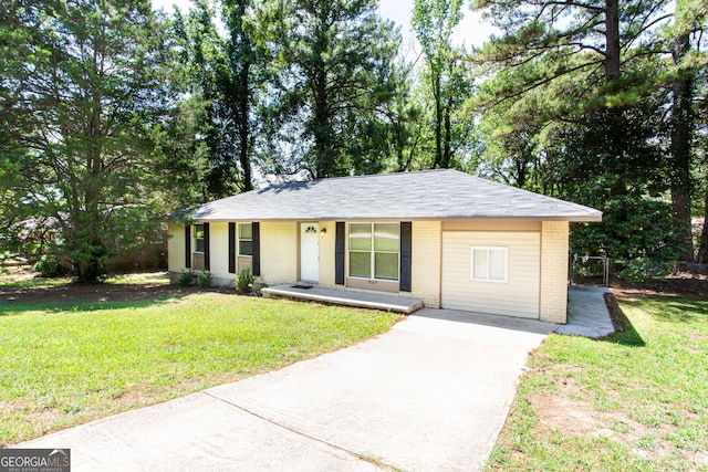 ranch-style home with concrete driveway, brick siding, a porch, and a front yard