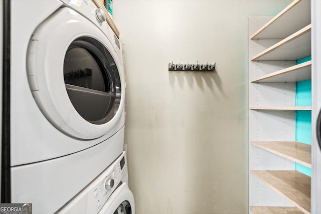 laundry room with laundry area and stacked washer / drying machine