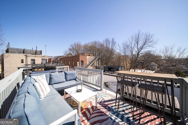 wooden deck with outdoor lounge area