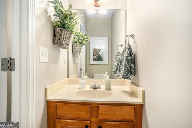 bathroom with vanity and toilet