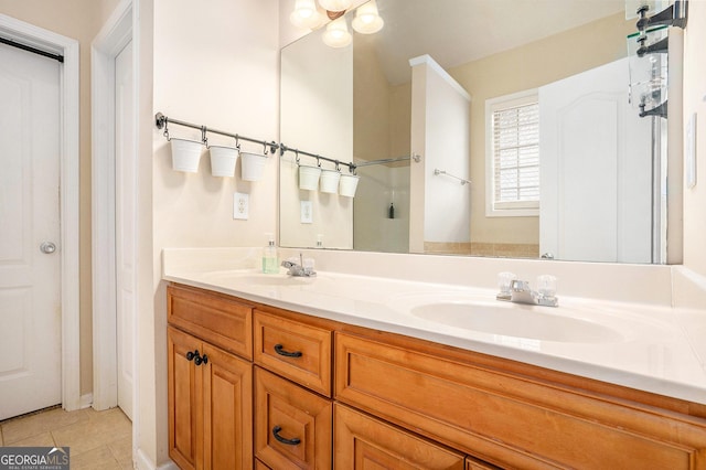 8000 Abington Dr, Locust Grove, GA 30248 - bathroom featuring double vanity and tile patterned flooring