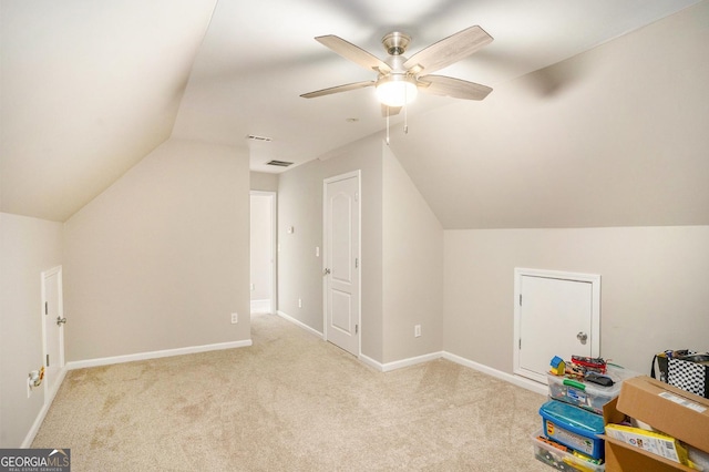 bonus room with carpet floors, lofted ceiling, baseboards, and a ceiling fan