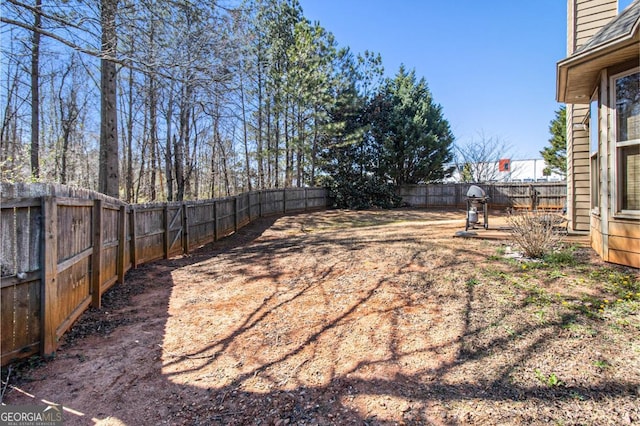 view of yard featuring a fenced backyard