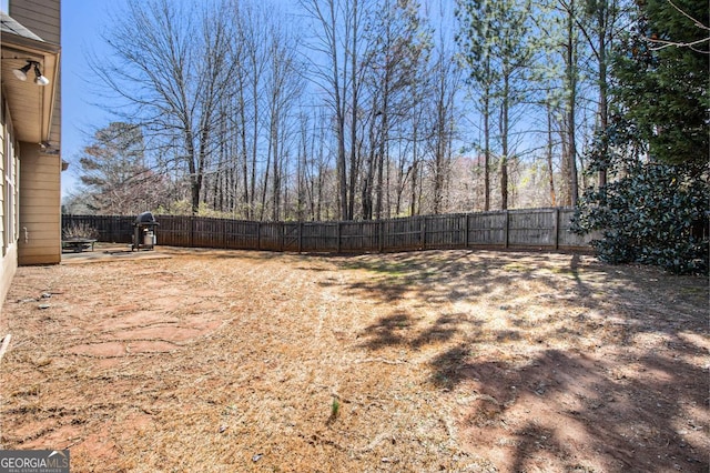 view of yard with a fenced backyard