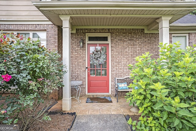 8000 Abington Dr, Locust Grove, GA 30248 - view of exterior entry featuring brick siding and a porch