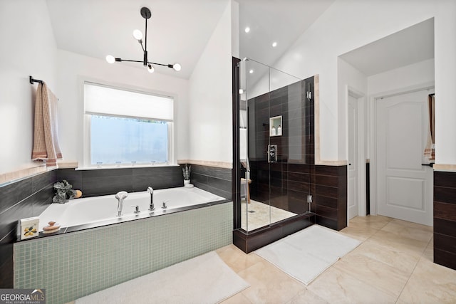 full bath with lofted ceiling, a stall shower, a bath, and tile patterned floors