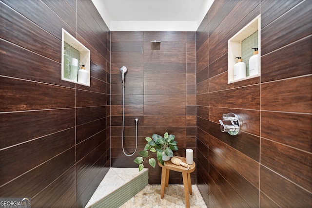 bathroom with a tile shower