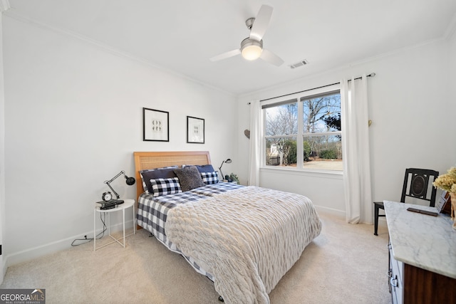 bedroom with light carpet, baseboards, visible vents, and crown molding