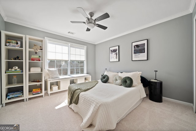 carpeted bedroom with visible vents, crown molding, and baseboards