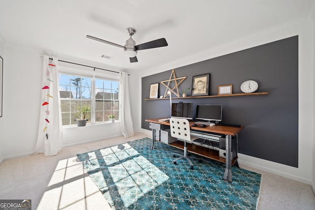 home office with carpet, visible vents, and crown molding