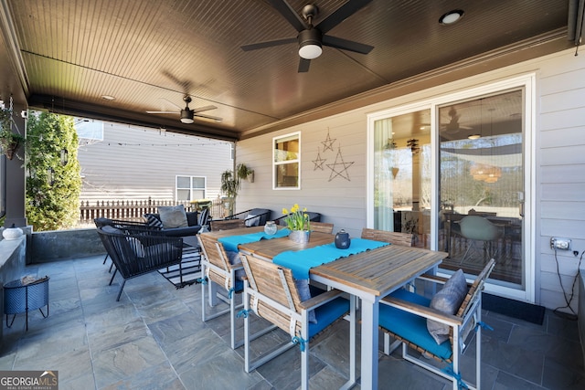 view of patio / terrace featuring outdoor dining space and ceiling fan