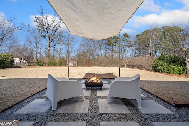 view of patio featuring a fire pit