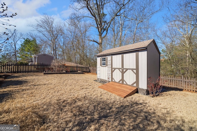 view of shed featuring a fenced backyard