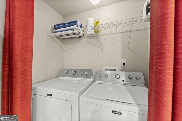 washroom featuring laundry area and washing machine and dryer