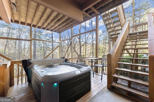 sunroom / solarium featuring a jacuzzi