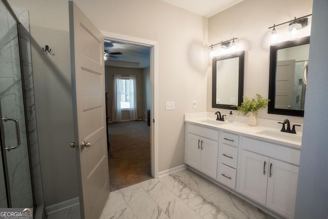 full bathroom with marble finish floor, a sink, and a shower stall