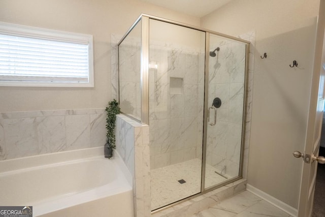full bathroom featuring marble finish floor, a garden tub, baseboards, and a marble finish shower