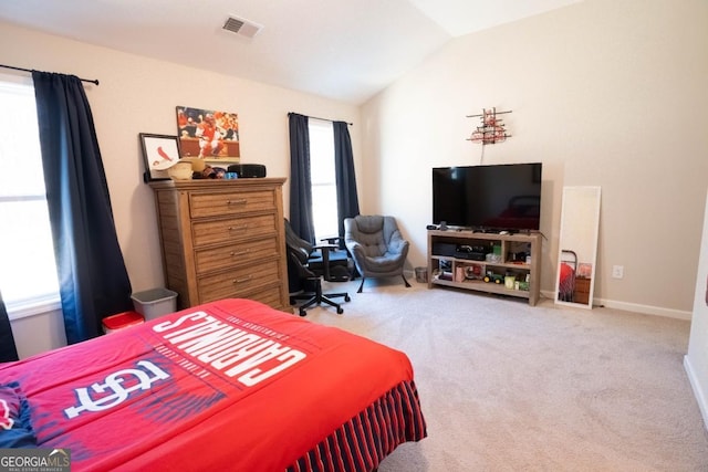 bedroom with carpet, visible vents, vaulted ceiling, and baseboards