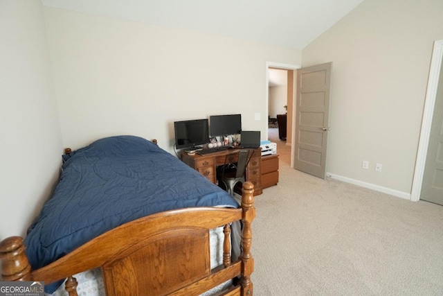 bedroom featuring lofted ceiling, baseboards, and light colored carpet