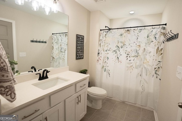 full bathroom with a shower with shower curtain, vanity, toilet, and tile patterned floors