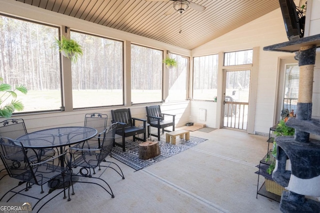 sunroom with wooden ceiling and vaulted ceiling