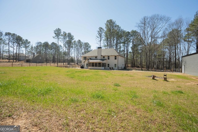 view of yard featuring fence