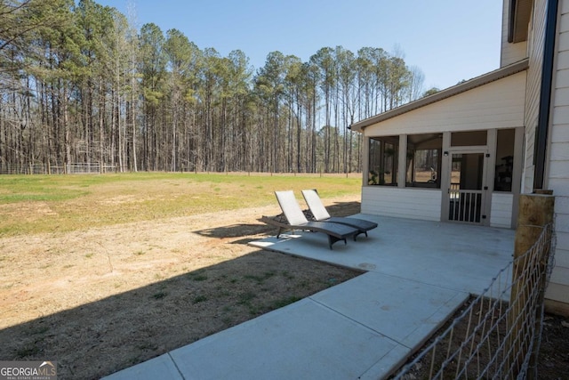 view of patio / terrace featuring a sunroom