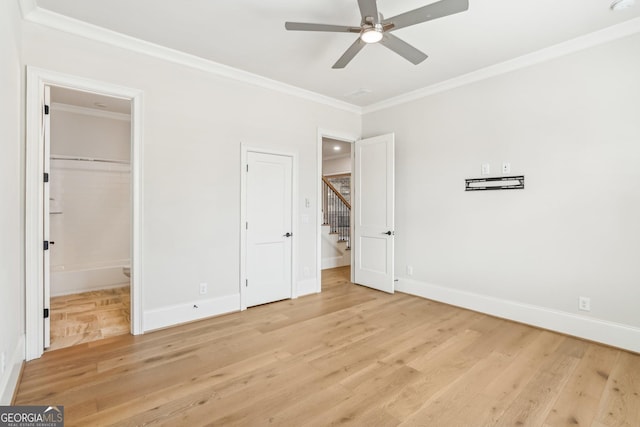 unfurnished bedroom with light wood-style flooring, baseboards, ceiling fan, and crown molding