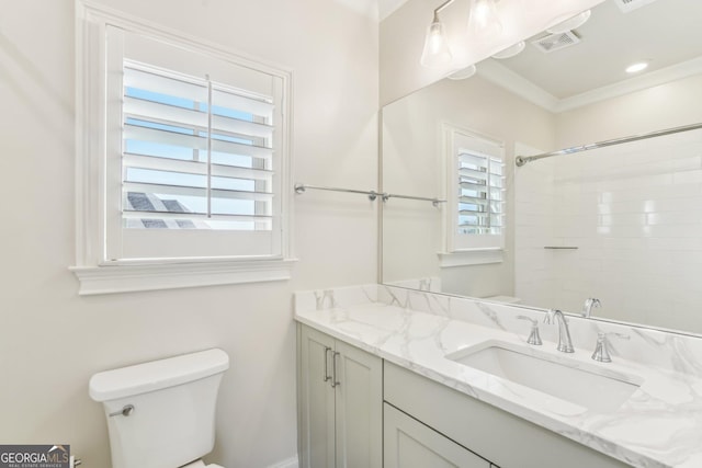 full bath featuring visible vents, toilet, ornamental molding, walk in shower, and vanity