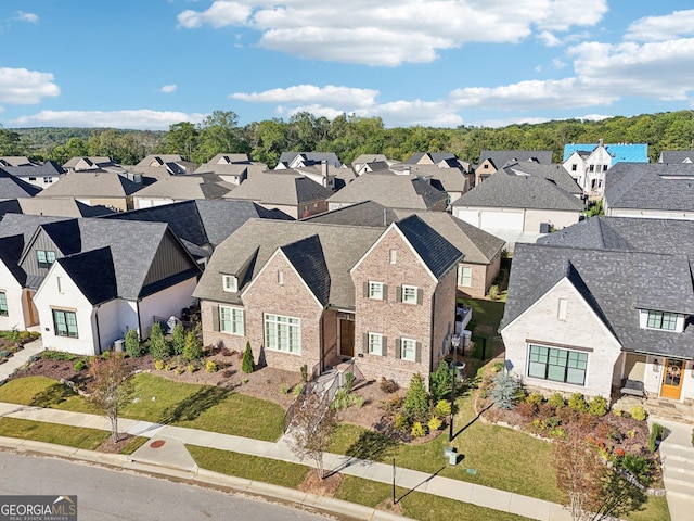 birds eye view of property with a residential view