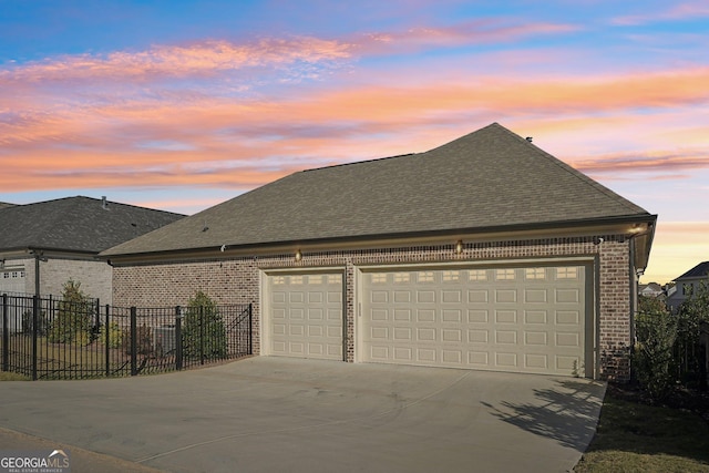 exterior space featuring fence and concrete driveway