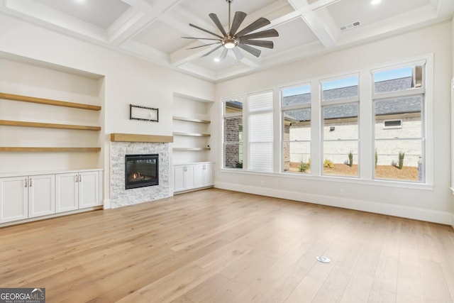 unfurnished living room with light wood-type flooring, coffered ceiling, visible vents, and baseboards