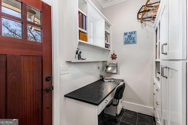 office with baseboards and crown molding