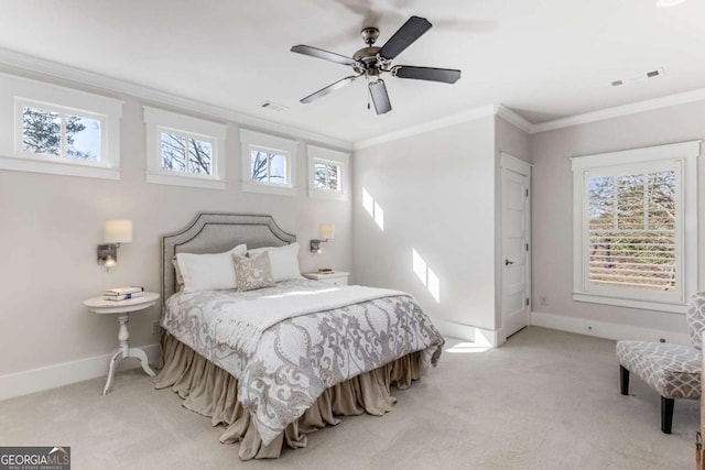 bedroom with ornamental molding, visible vents, and carpet floors