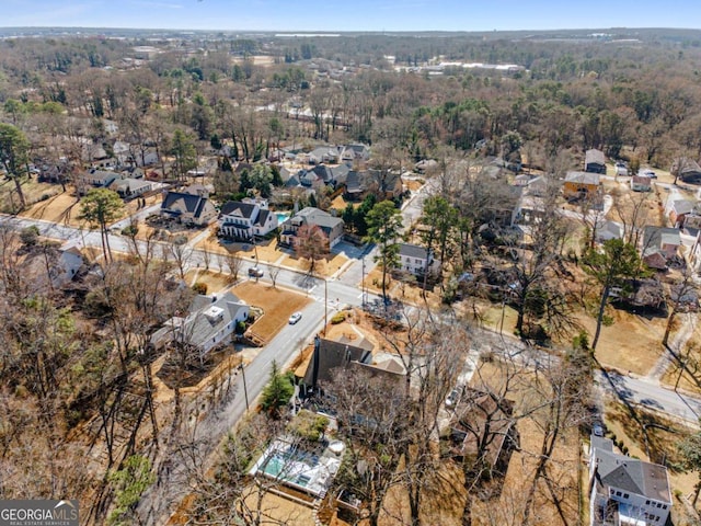 aerial view with a residential view and a wooded view