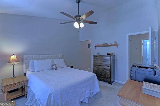 carpeted bedroom with ceiling fan and baseboards