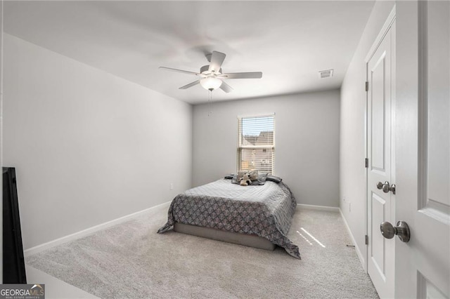 bedroom with carpet floors, visible vents, ceiling fan, and baseboards