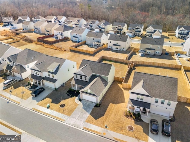 birds eye view of property with a residential view