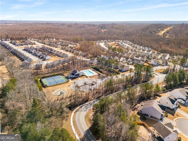 aerial view with a residential view and a view of trees