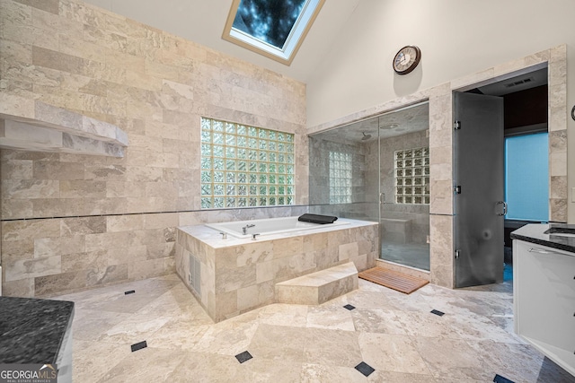 full bath featuring high vaulted ceiling, vanity, a shower stall, and a bath