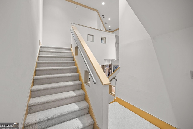 staircase with recessed lighting