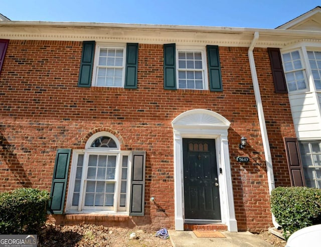 view of front of house featuring brick siding