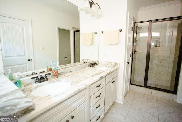 full bathroom featuring crown molding, a stall shower, a sink, and double vanity